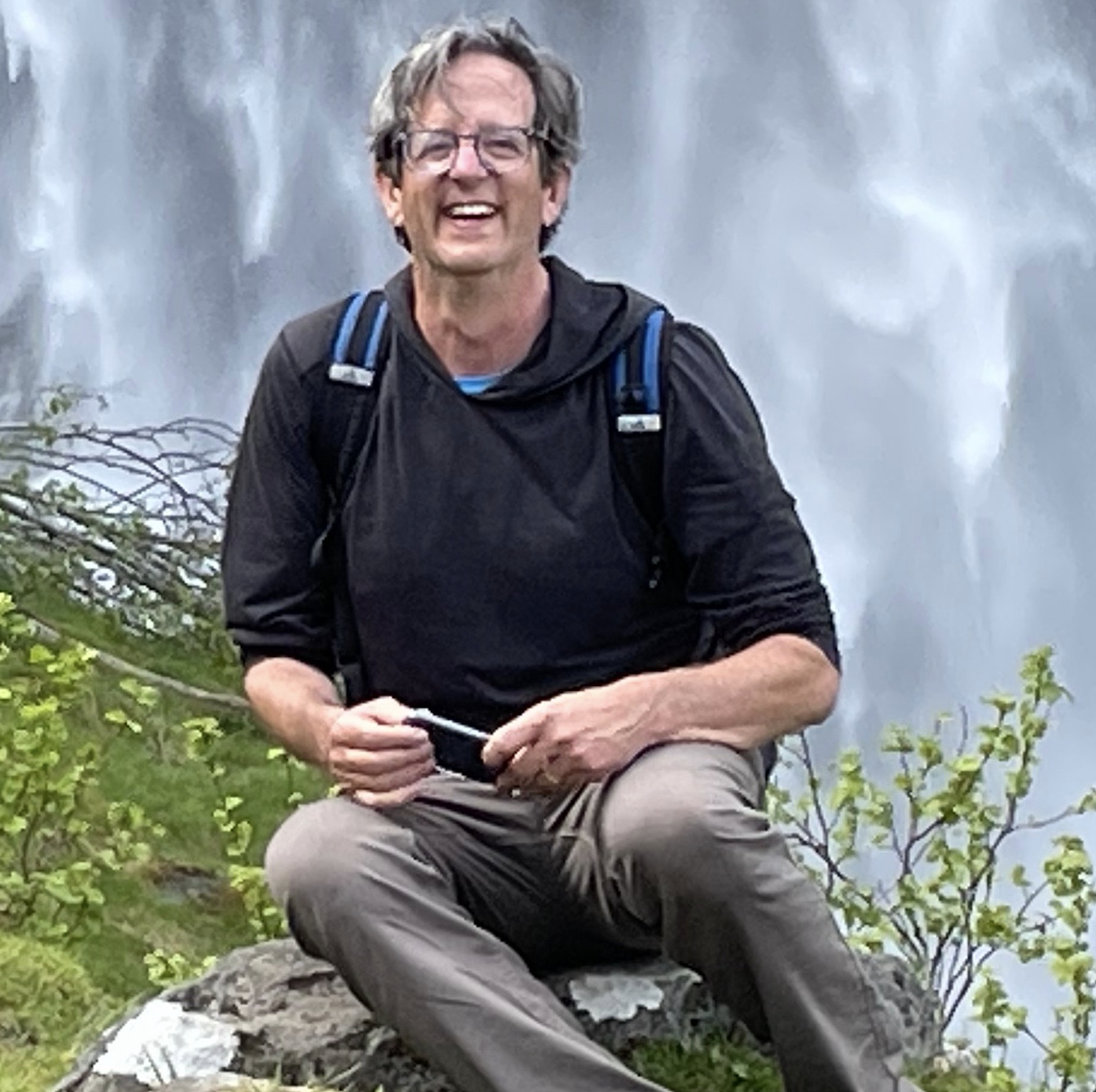 Stylized blue duotone portrait of a woman with long hair facing slightly backward